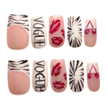 Set of nail art designs with zebra pattern, lips, and 'Vogue' text on a white background